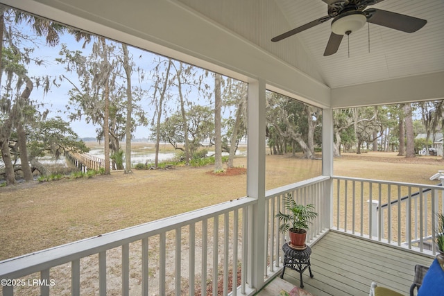 unfurnished sunroom featuring vaulted ceiling