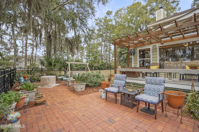 view of patio featuring fence and a pergola