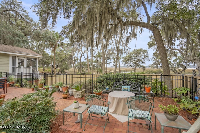 view of patio featuring fence