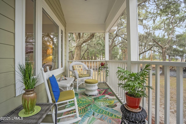sunroom / solarium featuring a healthy amount of sunlight