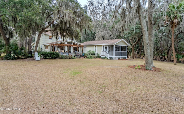 view of front of property with a front lawn and a sunroom