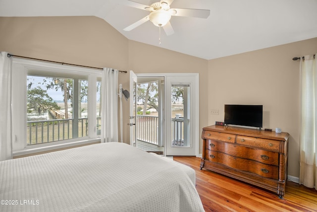 bedroom featuring lofted ceiling, a ceiling fan, access to outside, light wood-style floors, and baseboards