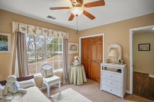 bedroom with a closet, visible vents, a ceiling fan, and baseboards