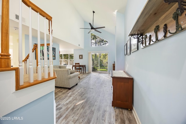 52 Lake Linden Ln Unit 52, Bluffton, SC 29910 - living area with ceiling fan, wood finished floors, high vaulted ceiling, and stairway