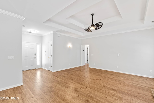 5 Susan Ct, Beaufort, SC 29907 - spare room featuring a raised ceiling, a chandelier, light wood-type flooring, baseboards, and ornamental molding