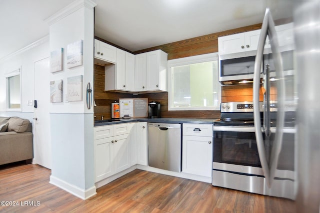 kitchen featuring white cabinetry, dark wood-type flooring, and stainless steel appliances