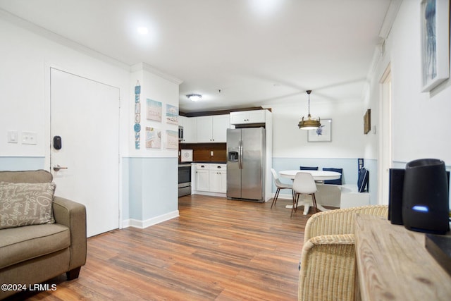 living room featuring crown molding and dark hardwood / wood-style floors