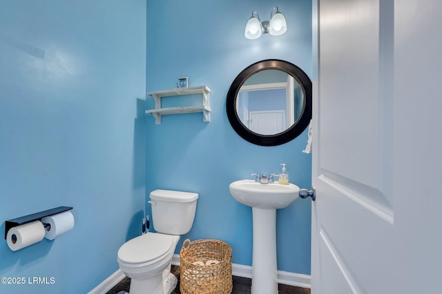 bathroom with toilet and sink