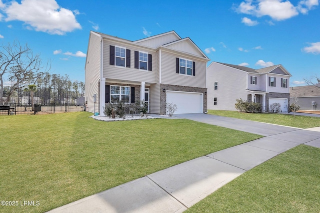 view of front of house featuring a garage and a front lawn