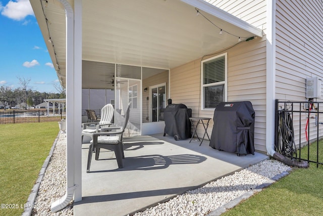 view of patio / terrace featuring a grill and ceiling fan