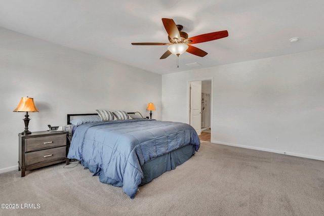 bedroom featuring light colored carpet and ceiling fan