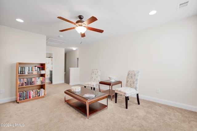 living area featuring light colored carpet