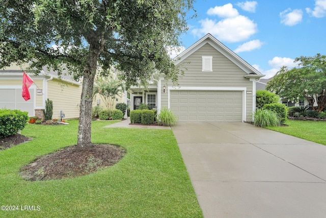 view of front of home featuring a garage and a front yard