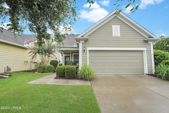 view of front of property with a garage and a front yard