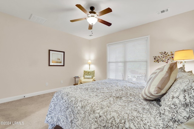 bedroom featuring light carpet and ceiling fan