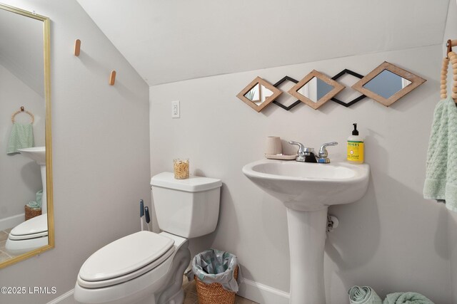 bathroom featuring toilet and sink