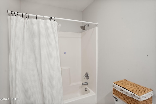 bathroom with shower / tub combo