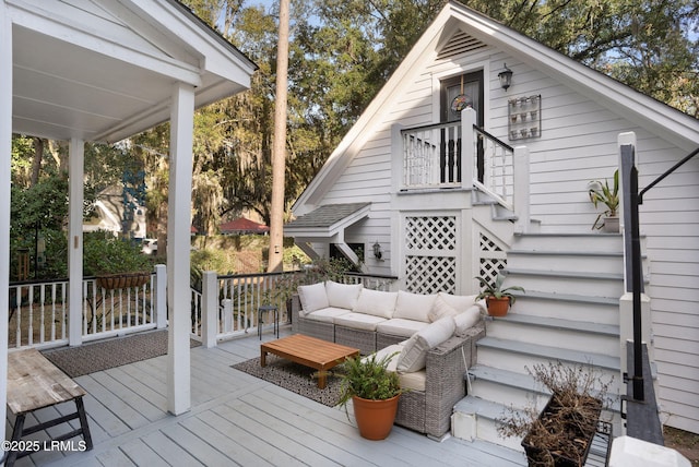 wooden terrace featuring outdoor lounge area