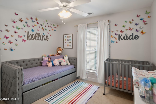 carpeted bedroom featuring multiple windows and ceiling fan