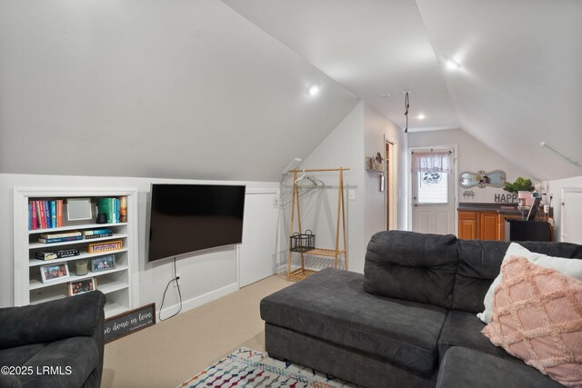 living room with light colored carpet and vaulted ceiling