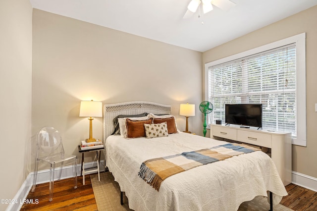 bedroom with dark wood-type flooring and ceiling fan