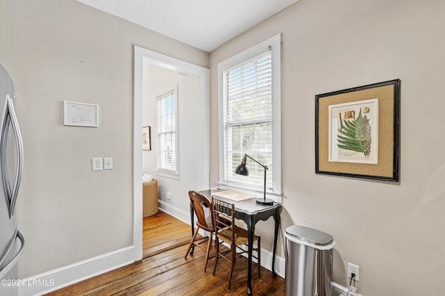 office space with dark hardwood / wood-style flooring