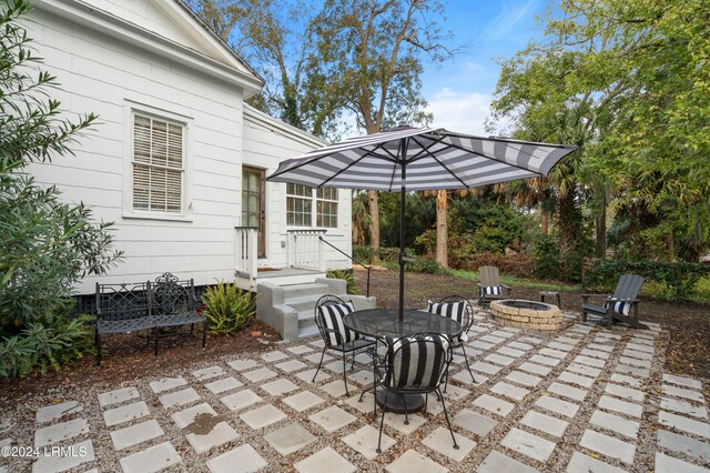 view of patio / terrace with an outdoor fire pit