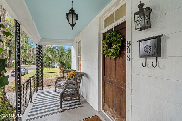 doorway to property featuring covered porch