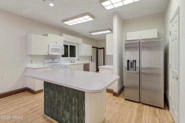 1 Royal James Dr, Hilton Head Island, SC 29926 - kitchen featuring stainless steel appliances, light countertops, and light wood-type flooring