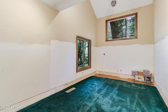 1 Royal James Dr, Hilton Head Island, SC 29926 - spare room with baseboards and high vaulted ceiling