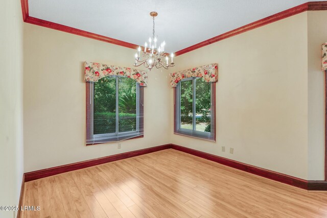 1 Royal James Dr, Hilton Head Island, SC 29926 - empty room with ornamental molding, a chandelier, wood finished floors, and baseboards