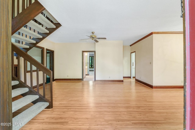 1 Royal James Dr, Hilton Head Island, SC 29926 - unfurnished living room featuring wood finished floors, a ceiling fan, baseboards, and stairway