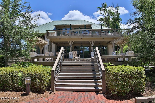 1 Royal James Dr, Hilton Head Island, SC 29926 - rear view of house featuring stairway, a balcony, metal roof, and a porch