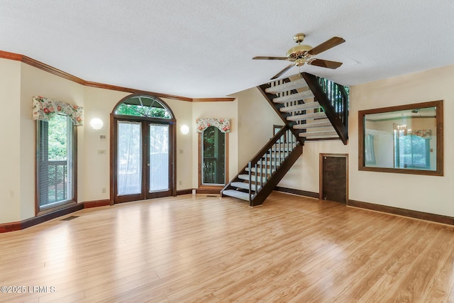 1 Royal James Dr, Hilton Head Island, SC 29926 - foyer entrance featuring stairs, light wood finished floors, a textured ceiling, baseboards, and crown molding