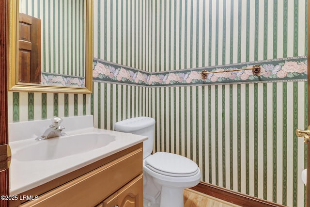1 Royal James Dr, Hilton Head Island, SC 29926 - half bath with wood finished floors, vanity, and toilet