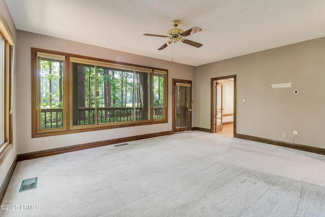 1 Royal James Dr, Hilton Head Island, SC 29926 - empty room featuring light colored carpet, baseboards, and ceiling fan