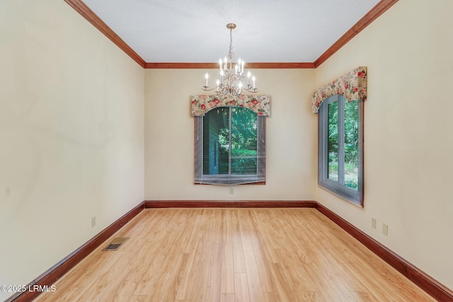 1 Royal James Dr, Hilton Head Island, SC 29926 - spare room featuring a chandelier, wood finished floors, crown molding, and baseboards