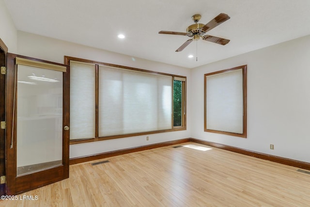 1 Royal James Dr, Hilton Head Island, SC 29926 - spare room with wood finished floors, baseboards, a ceiling fan, and recessed lighting