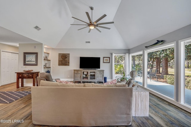 living room with ceiling fan, hardwood / wood-style floors, and high vaulted ceiling