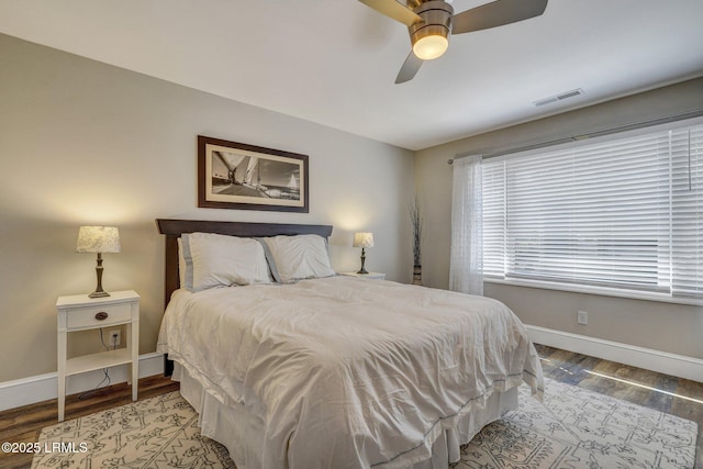 bedroom featuring hardwood / wood-style flooring and ceiling fan