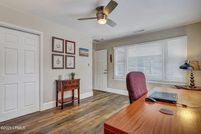 office area with dark wood-type flooring and ceiling fan