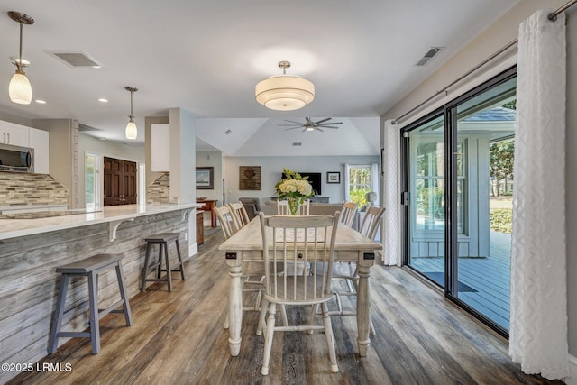 dining room with dark wood-type flooring