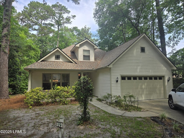 19 Celosia Ln, Hilton Head Island, SC 29926 - view of front of house with a shingled roof, concrete driveway, and a garage
