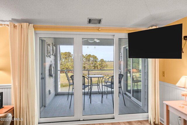 167 Beach Club Villa Dr Unit 167, Fripp Island, SC 29920 - dining area with wainscoting, wood finished floors, and a ceiling fan