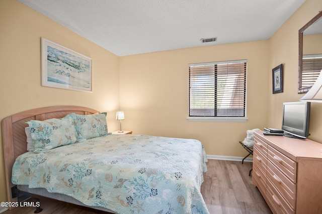 167 Beach Club Villa Dr Unit 167, Fripp Island, SC 29920 - bedroom featuring wood finished floors and baseboards