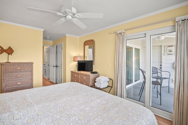 167 Beach Club Villa Dr Unit 167, Fripp Island, SC 29920 - bedroom featuring access to exterior, crown molding, wood finished floors, and a ceiling fan