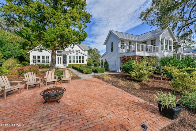 view of patio / terrace with a fire pit