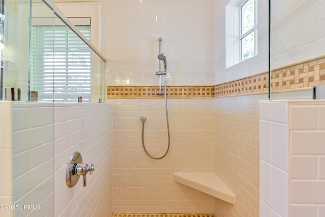 full bath with tiled shower