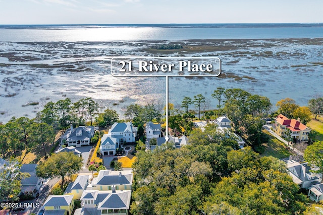 birds eye view of property featuring a residential view and a water view