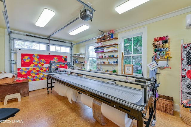 recreation room with tile patterned floors and a garage